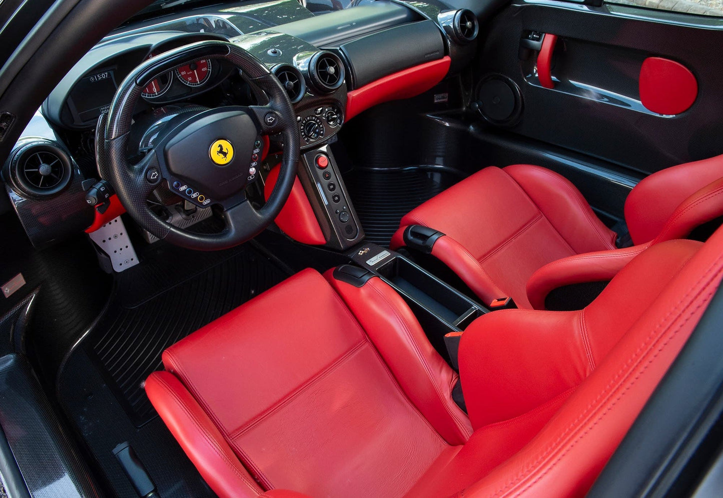 Interior of the 2002 Ferrari Enzo – High-performance cockpit with carbon fiber details.
