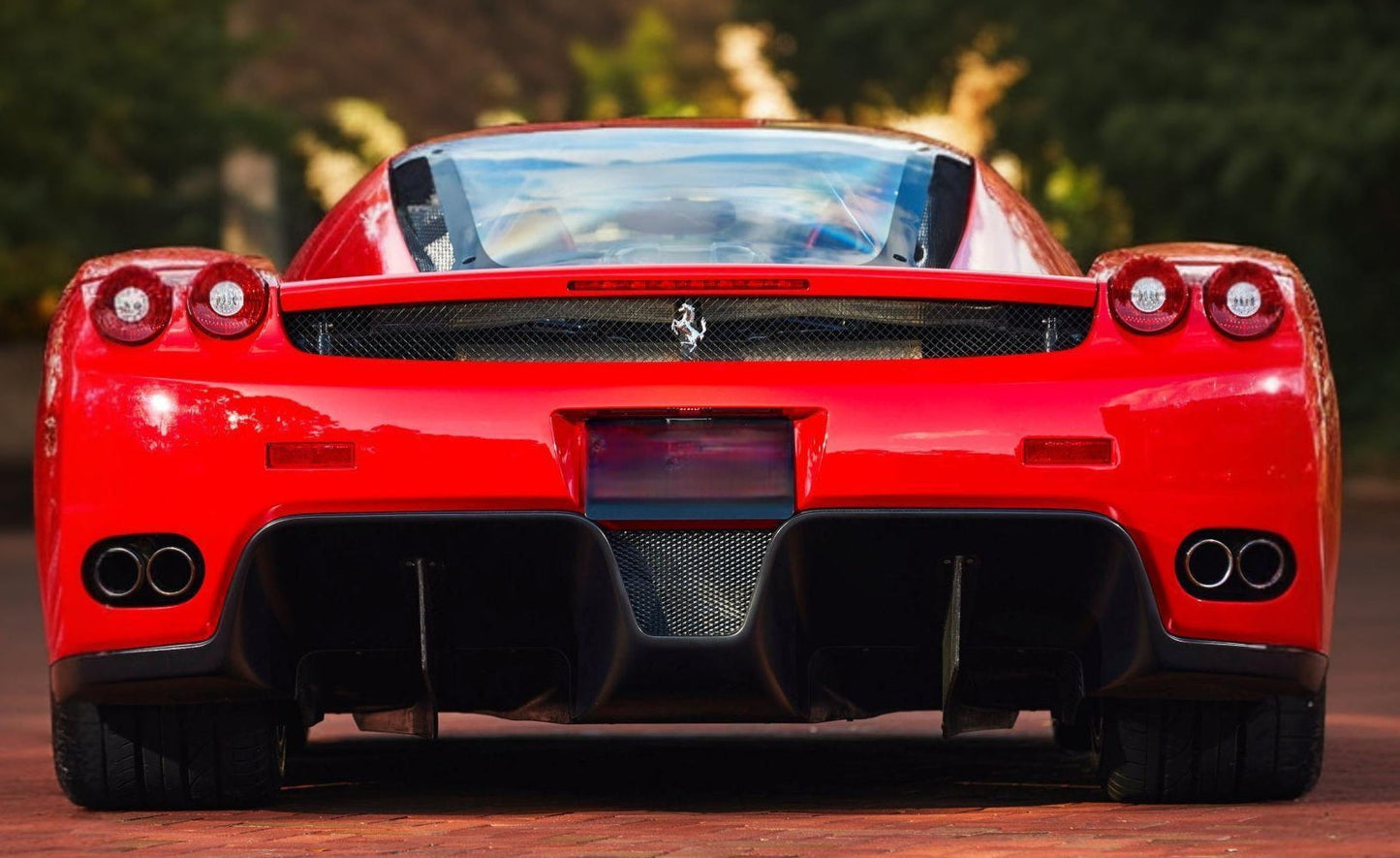 Rear view of the 2002 Ferrari Enzo – Signature tail design with distinctive exhaust and lights.