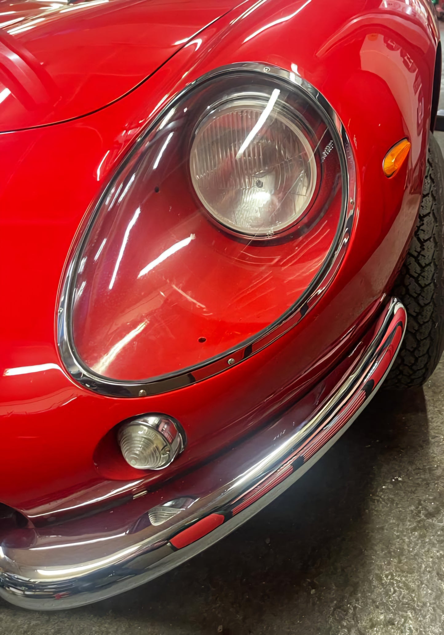 Close-up of the 1966 Ferrari 275 GTB headlight – Classic Ferrari design with vintage detailing.