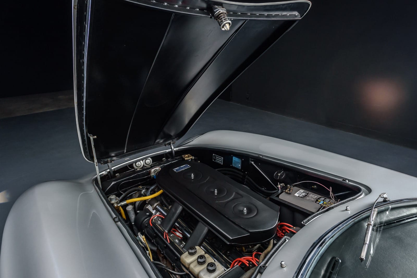 Engine bay of the 1967 Ferrari 275 GTB – Powerful V12 engine, meticulously maintained.