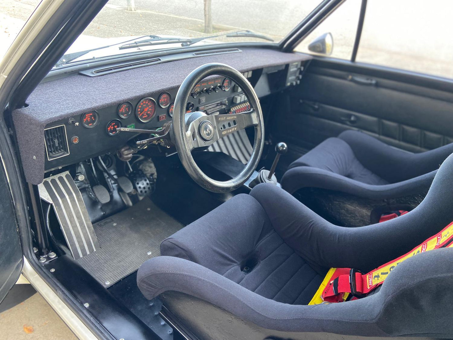 Interior of the 1977 Fiat 131 Abarth – Original racing cockpit with period-correct details.