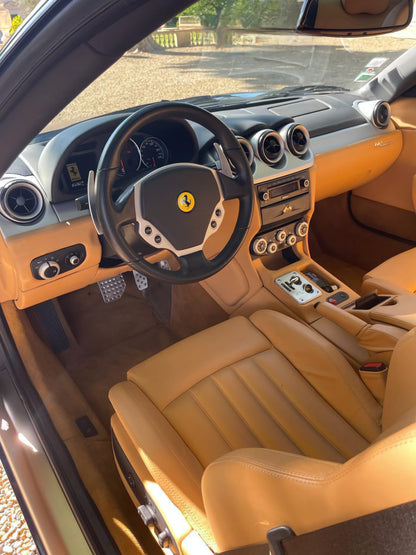 Interior of the 2005 Ferrari 612 Scaglietti – Luxurious beige leather cabin with handcrafted details.