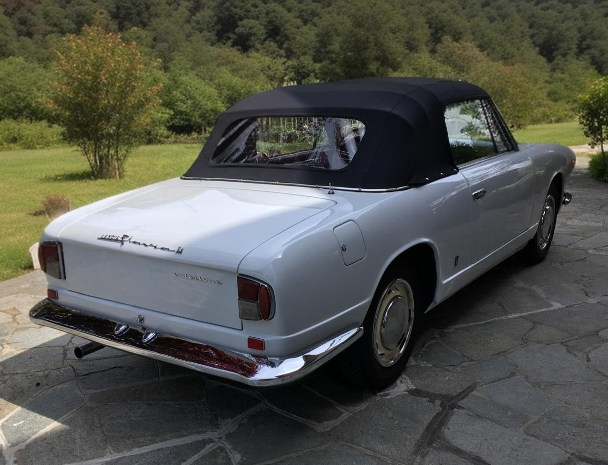 1966 Lancia Flavia Vignale rear view with soft top closed, showcasing elegant Italian design.