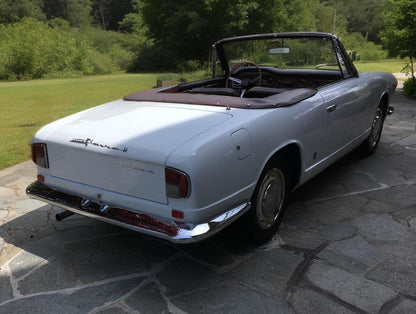 Rear view of the 1966 Lancia Flavia Vignale with soft top open – Classic open-top styling with refined details.