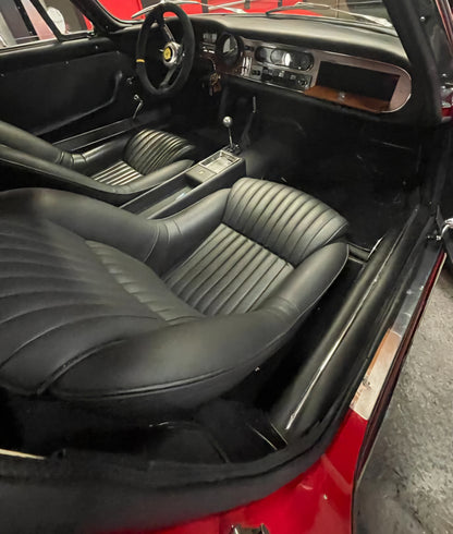 Interior of the 1966 Ferrari 275 GTB – Black leather cockpit with timeless Ferrari craftsmanship.