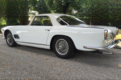 Left side view of the 1961 Maserati 3500 – Iconic grand tourer with sleek proportions.