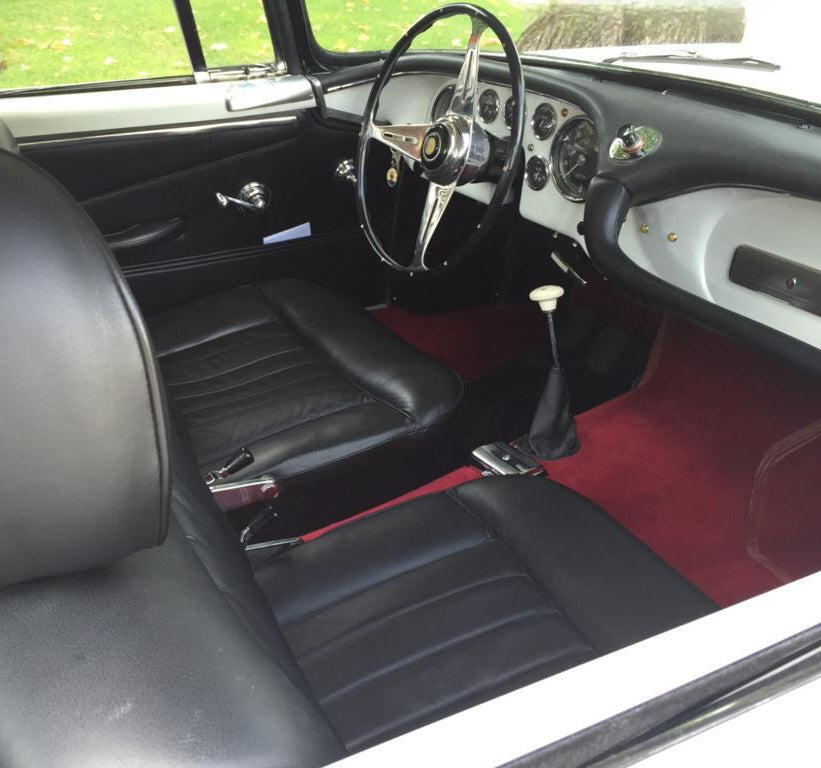 Interior of the 1961 Maserati 3500 – Luxurious vintage cockpit with refined craftsmanship.